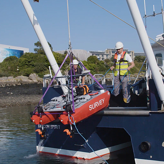 Uncrewed vessel being released into the water