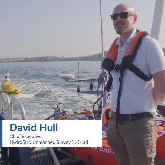 Chief Executive David Hull standing on a boat